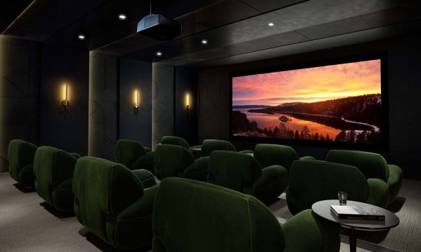 green seating in a home theater with sony projector and screen