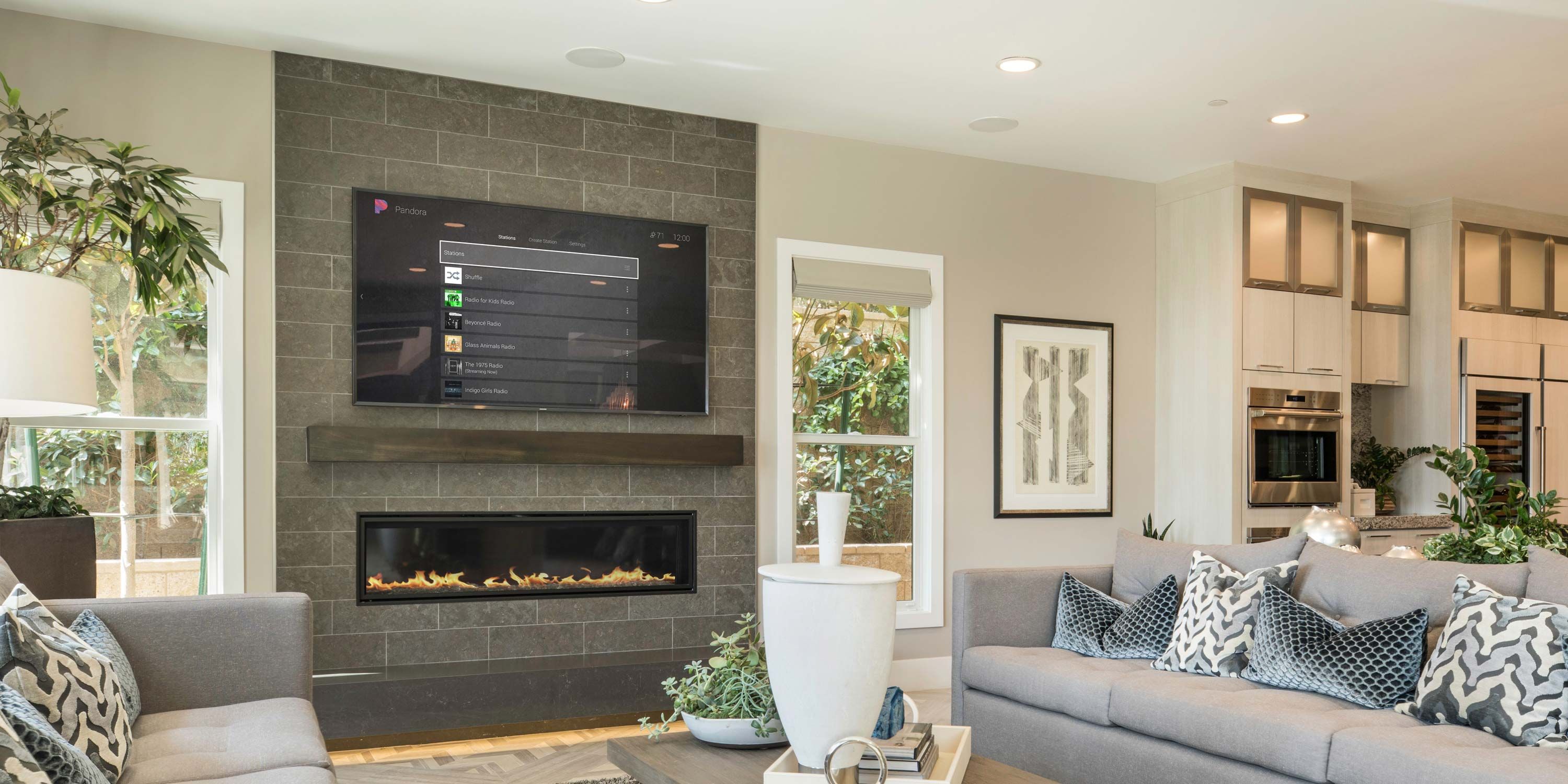 living room with control4 technology and a modern brick fireplace